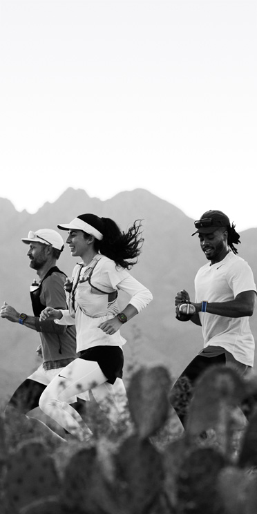 Three people running on a desert trail track their workout on Lipagas Vertical Models Ultra 3